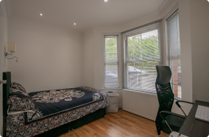 Bed & Study Table in Wide Window Room